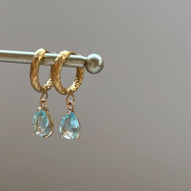 Pendientes de aro acero bañado en oro 18K y cristal aguamarina